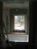 Self adhesive water proof membrane shower stall prep for tile