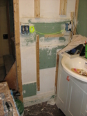 patching holes from electrical electrican MEP work fireproofing foam taping and spackling shower and tub caulk recycling construction material recycling job site wastes GREEN building