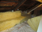 Superinsulation attic retrofit completed 20 inches fiberglass batt R60 average