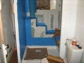 Self adhesive water proof membrane shower stall prep for tile