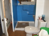 Self adhesive water proof membrane shower stall prep for tile