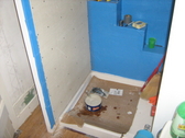 Self adhesive water proof membrane shower stall prep for tile