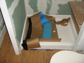Self adhesive water proof membrane shower stall prep for tile